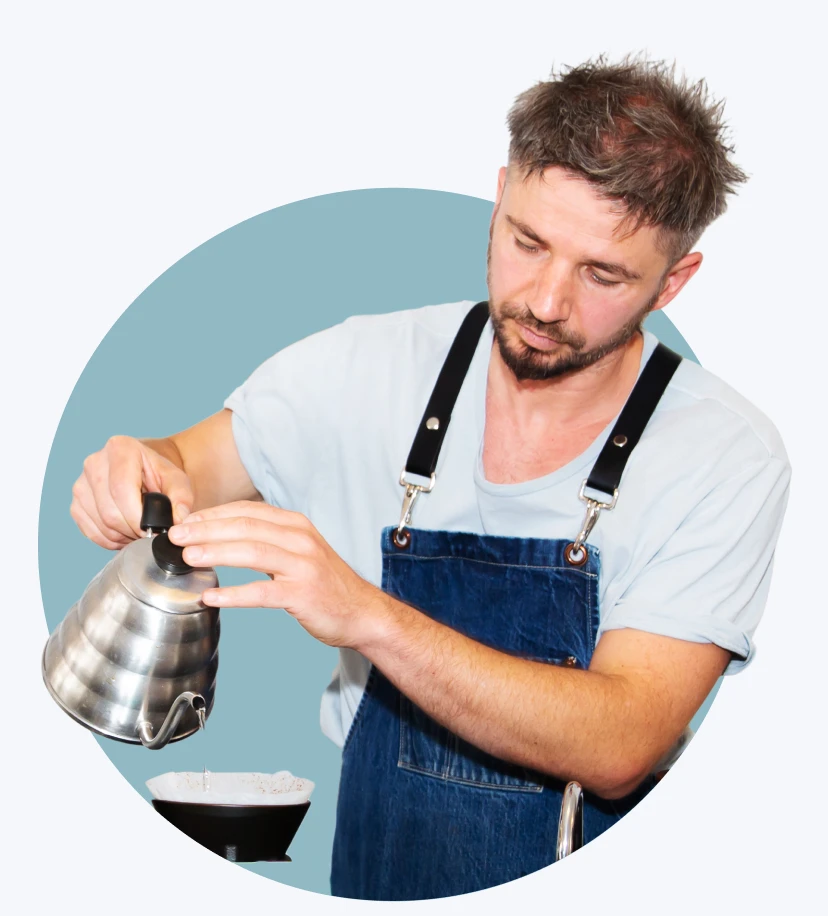 Barista pouring coffee